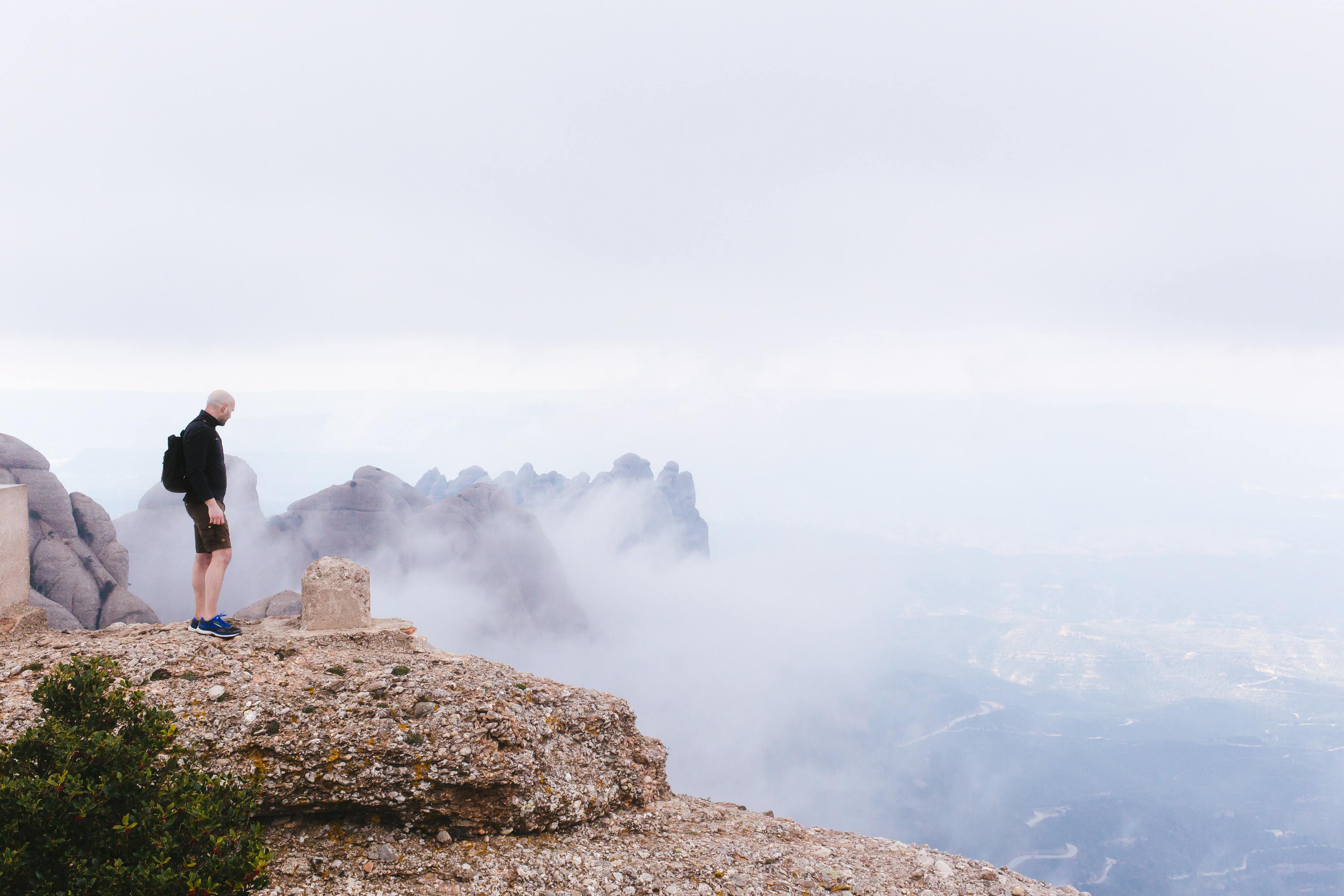 Man watching a landscape on the top of a mountain