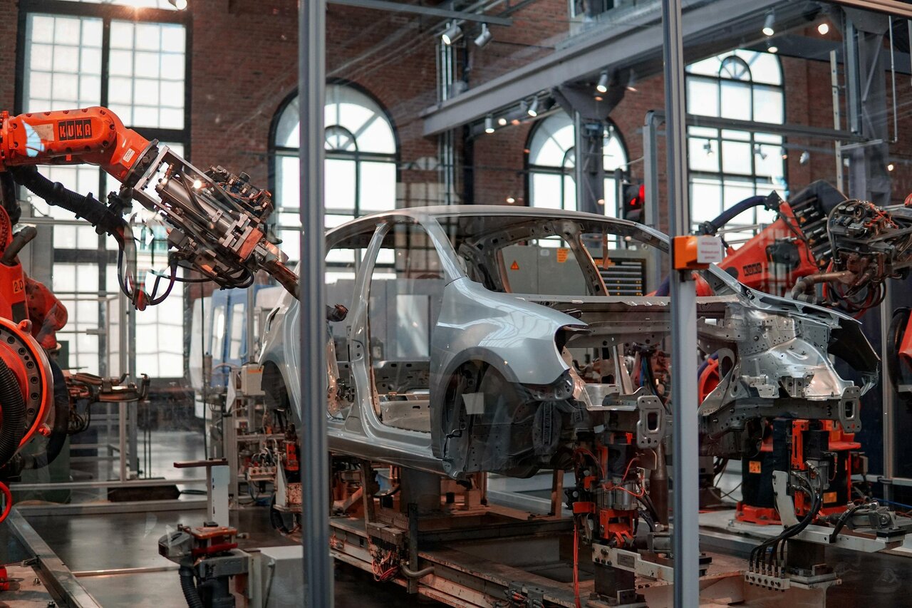 Robots manufacturing a car in a factory