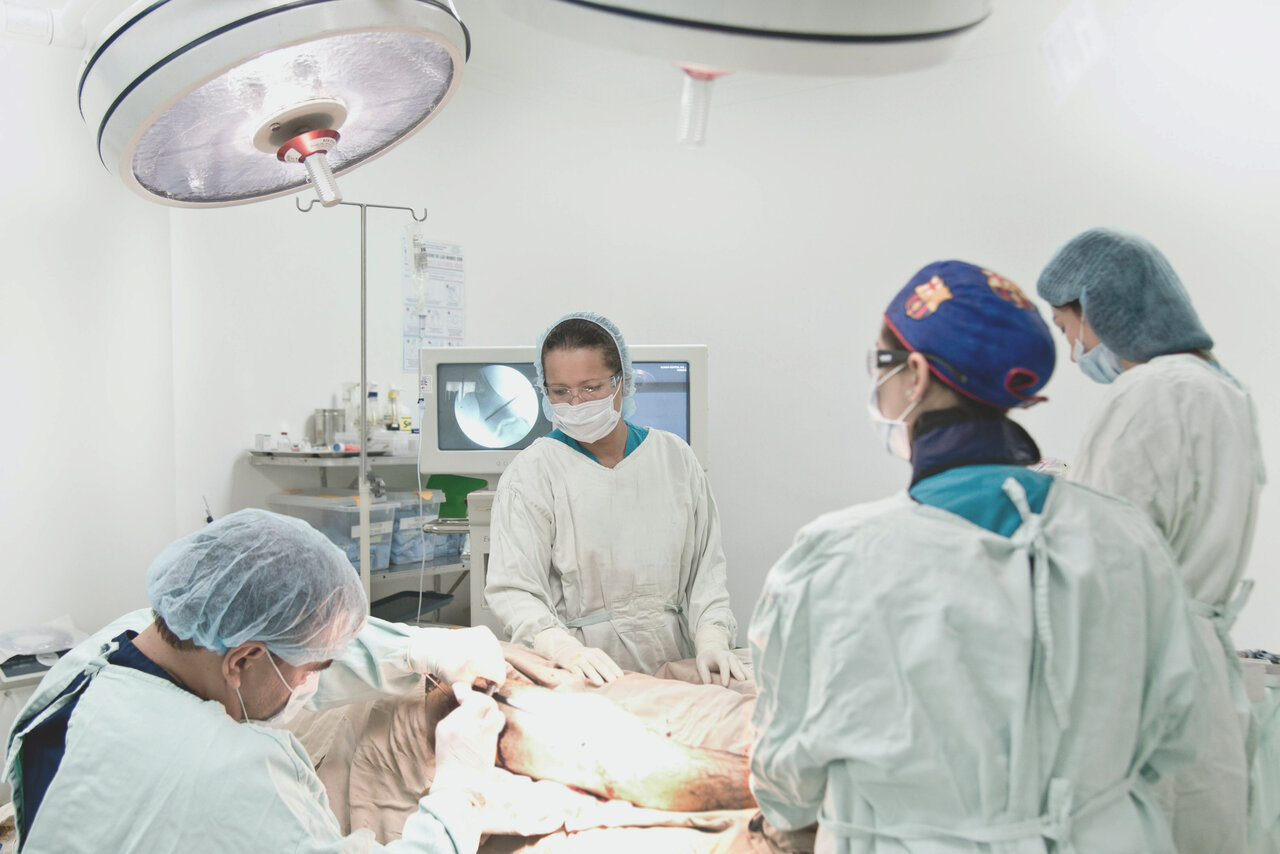 Doctors doing surgery in an operating room