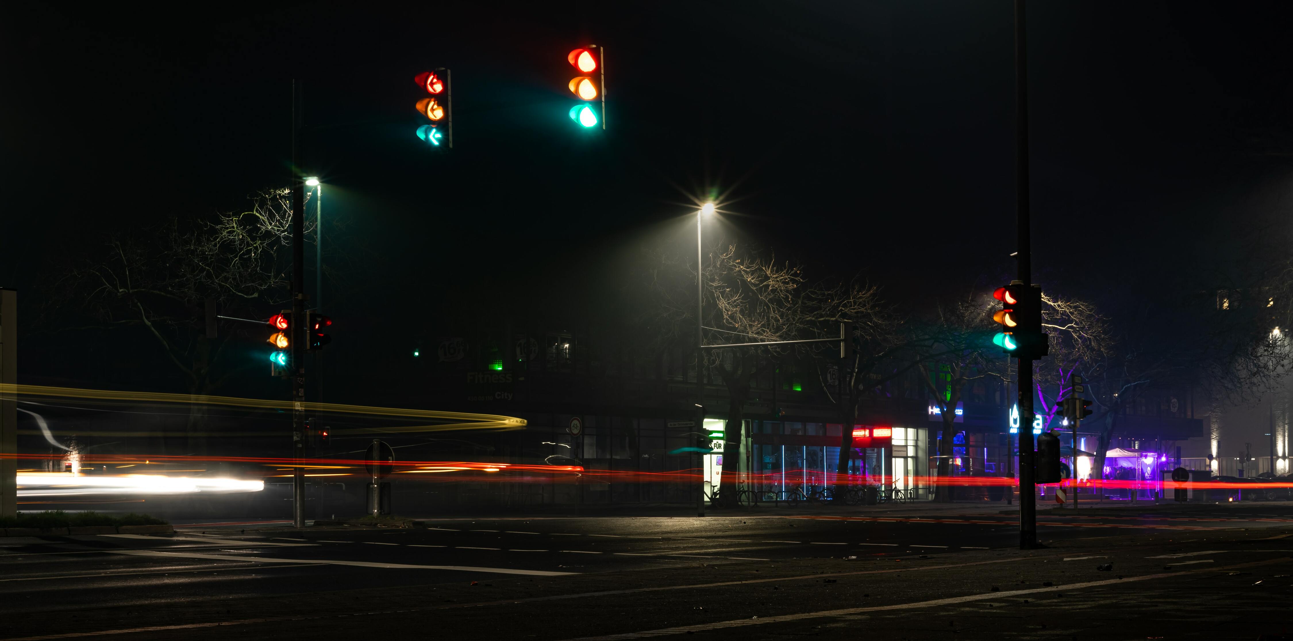 Road with traffic lights at night