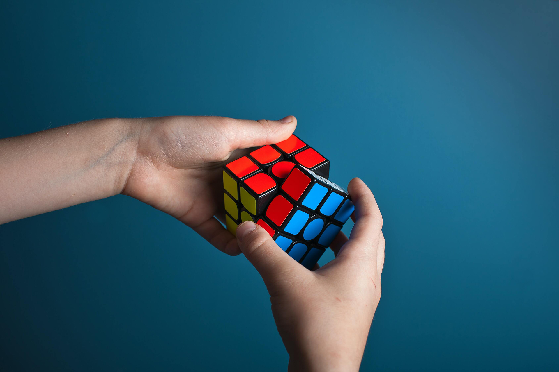 Person solving a rubik's cube